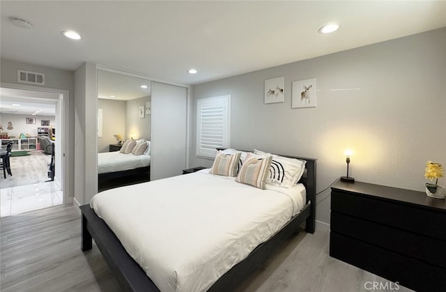 bedroom with light wood-type flooring