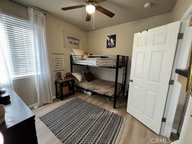 bedroom featuring ceiling fan and wood-type flooring