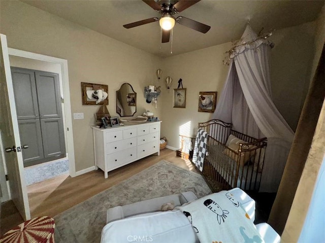 bedroom with ceiling fan and light hardwood / wood-style floors