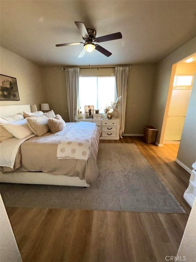 bedroom featuring ceiling fan and hardwood / wood-style floors