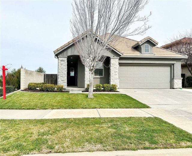 view of front of house with a front lawn and a garage