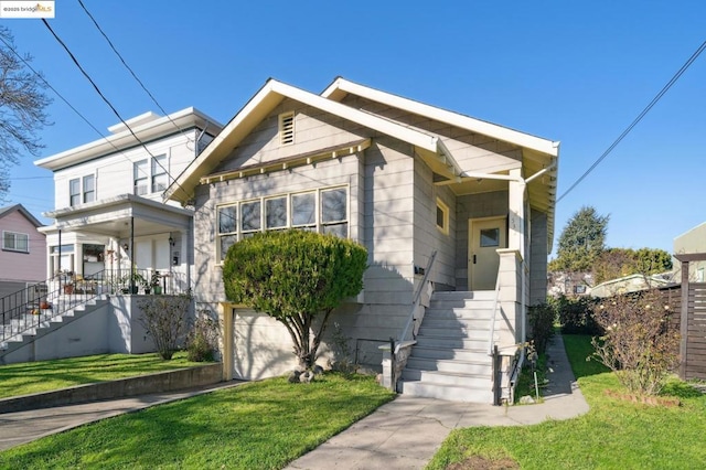 view of front of house with a front lawn and a garage