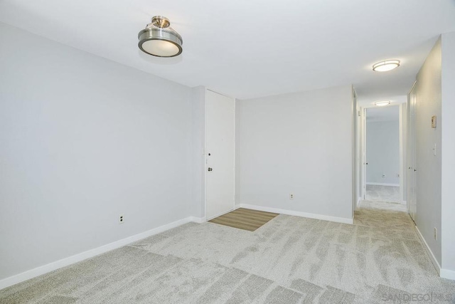 spare room with light carpet