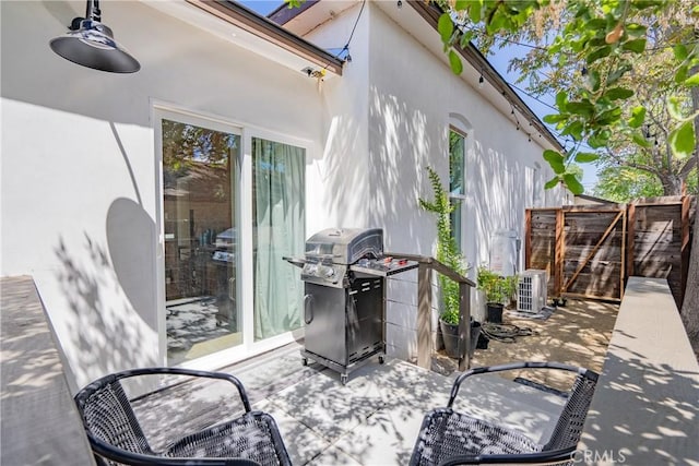 view of patio / terrace featuring a gate, fence, and grilling area