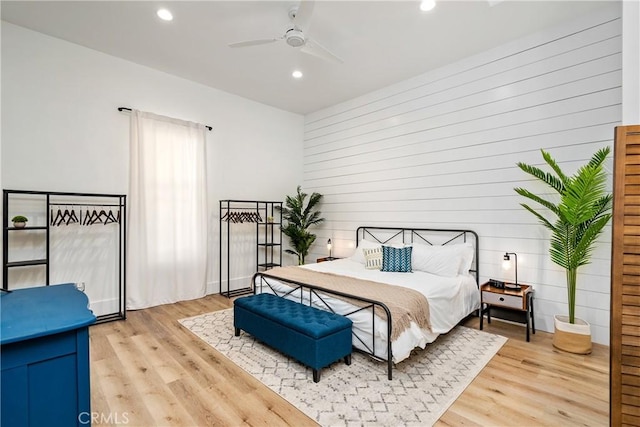 bedroom with light wood-type flooring, ceiling fan, and recessed lighting