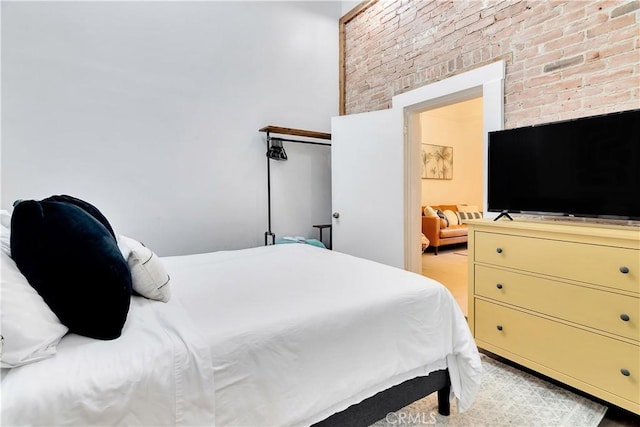 bedroom with brick wall