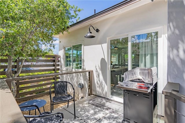 view of patio featuring fence