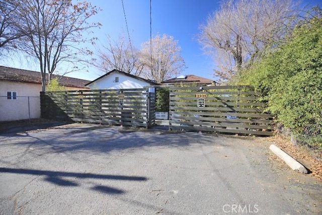 view of gate featuring fence