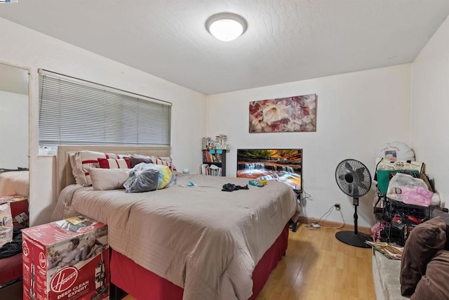 bedroom with light hardwood / wood-style flooring