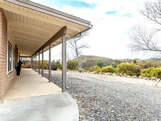 view of patio / terrace with a mountain view