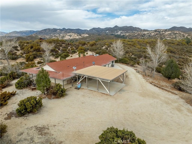 drone / aerial view featuring a mountain view