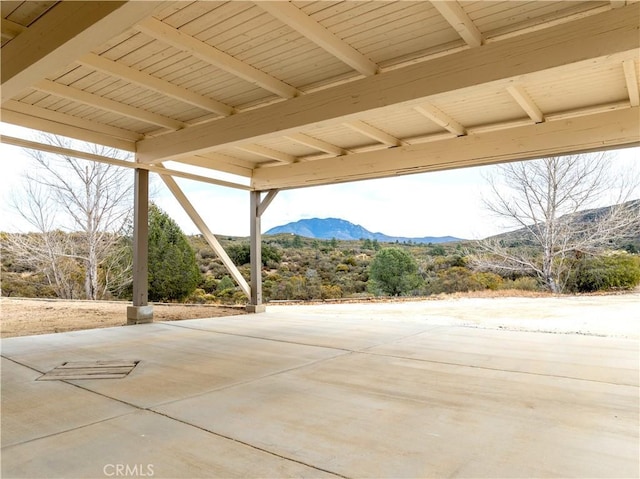 view of patio / terrace featuring a mountain view