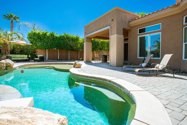 view of pool with an outdoor hangout area and a patio area