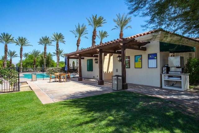 exterior space featuring a fenced in pool, a patio, and a lawn