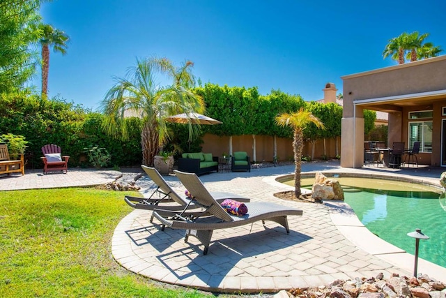 view of swimming pool featuring outdoor lounge area and a patio area