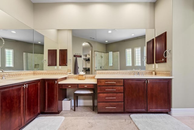 bathroom with vanity and plenty of natural light