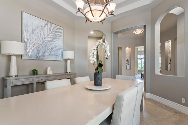 dining room with a notable chandelier