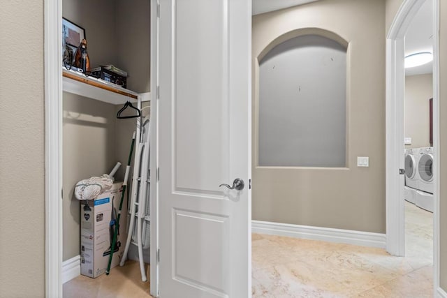 interior space featuring separate washer and dryer and tile patterned floors