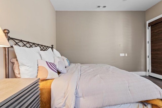 bedroom featuring dark hardwood / wood-style floors