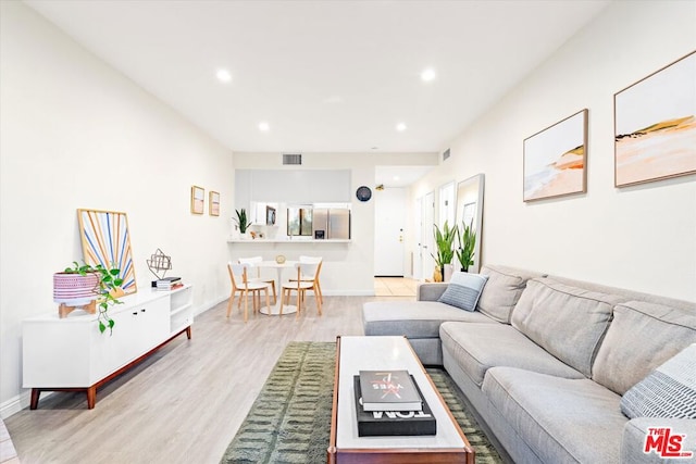 living room featuring light wood-type flooring