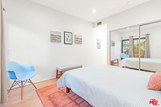 bedroom featuring a closet and light hardwood / wood-style floors