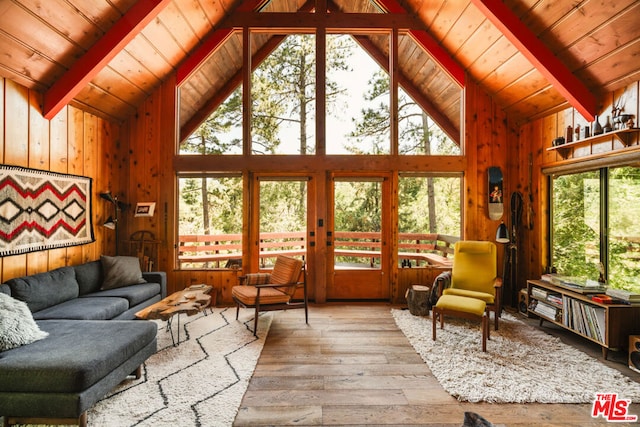 sunroom with vaulted ceiling with beams and wooden ceiling