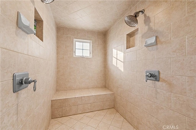 bathroom featuring a tile shower