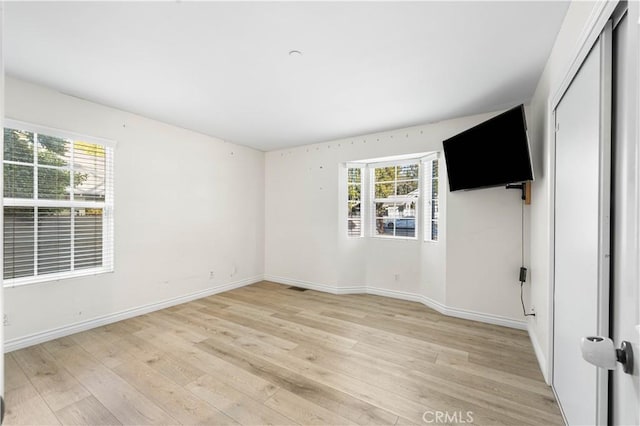 unfurnished bedroom with light hardwood / wood-style flooring