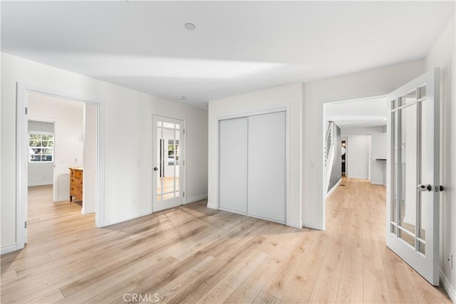 interior space with light hardwood / wood-style floors and a closet