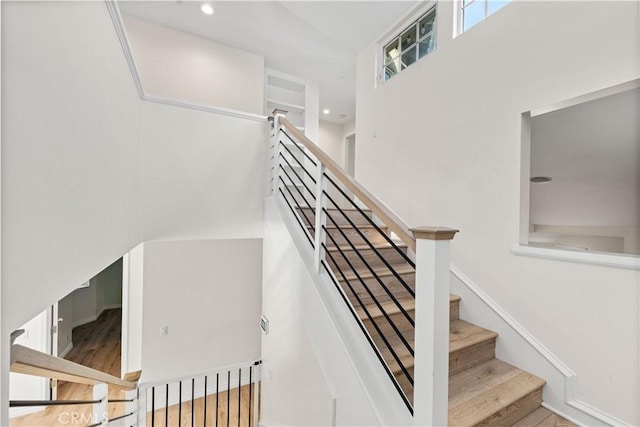 staircase featuring hardwood / wood-style floors