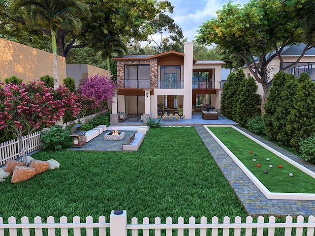 exterior space featuring a balcony, an outdoor fire pit, a yard, and a patio