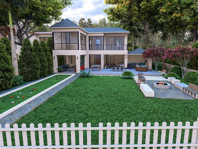 rear view of property with an outdoor living space with a fire pit, a patio area, a sunroom, and a lawn