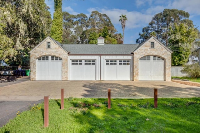 garage with a lawn