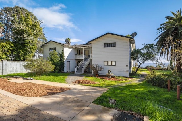 view of front of home with a front lawn