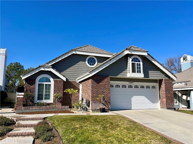 view of front of house with a front yard and a garage