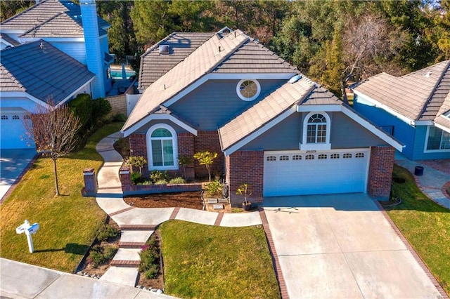 front of property featuring a front lawn and a garage