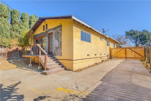 view of property exterior featuring a patio