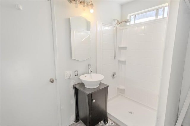 bathroom featuring vanity and a shower