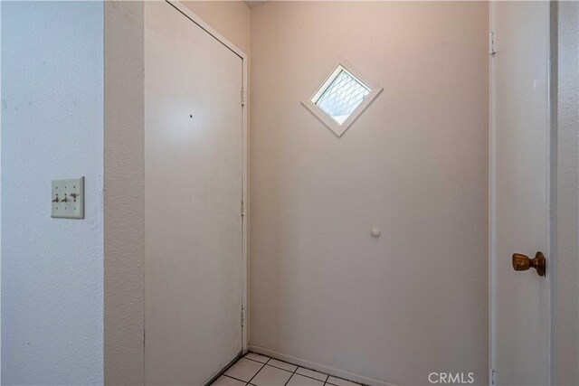 interior space with light tile patterned floors