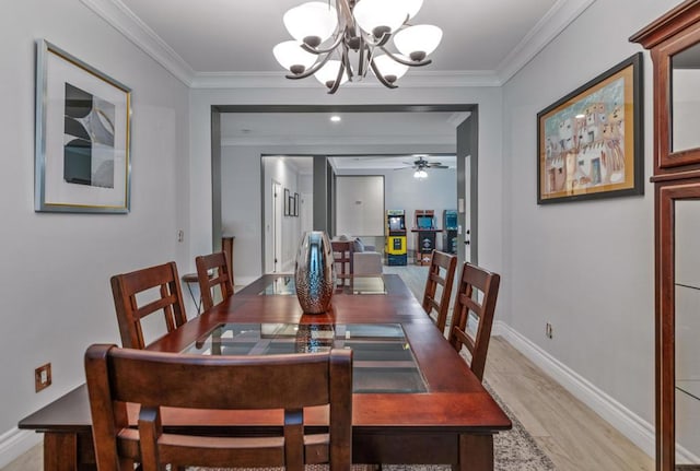 dining area with light hardwood / wood-style floors, ornamental molding, and ceiling fan with notable chandelier