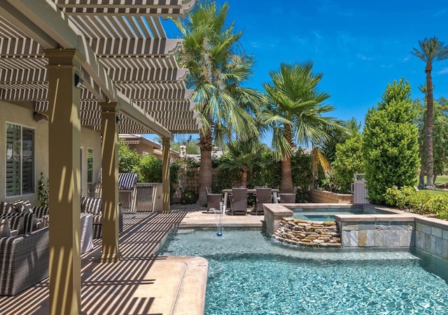 view of pool featuring an in ground hot tub, a patio, pool water feature, and a pergola