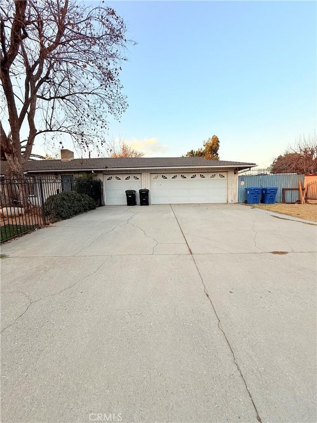 single story home with a garage