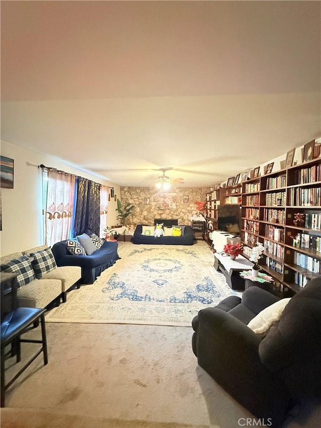 living room featuring ceiling fan and carpet floors