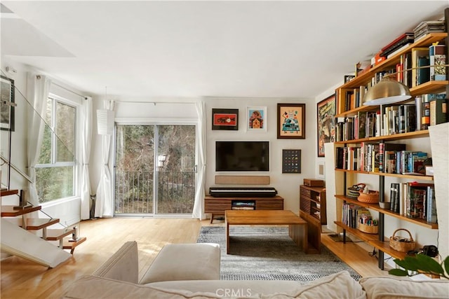 living room featuring light hardwood / wood-style flooring and plenty of natural light