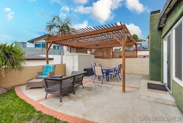 view of patio with outdoor lounge area and a pergola