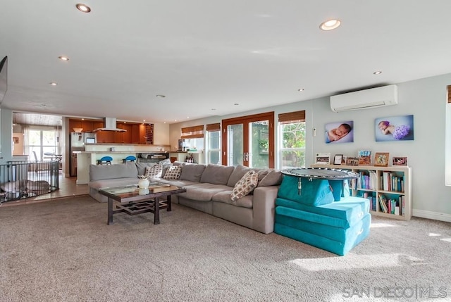 carpeted living room with a wall mounted air conditioner