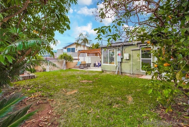 view of yard with a pergola and a patio