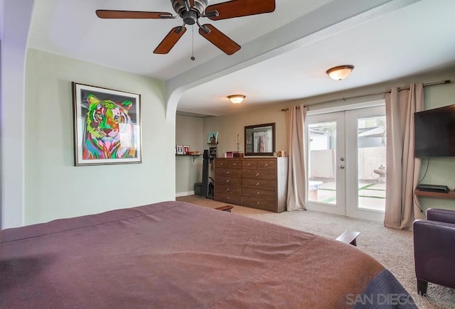 carpeted bedroom with french doors, ceiling fan, and access to exterior