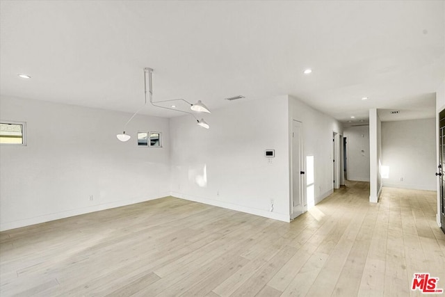 empty room with light wood-type flooring