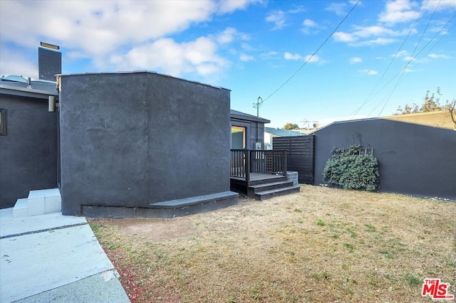 view of side of property with a yard